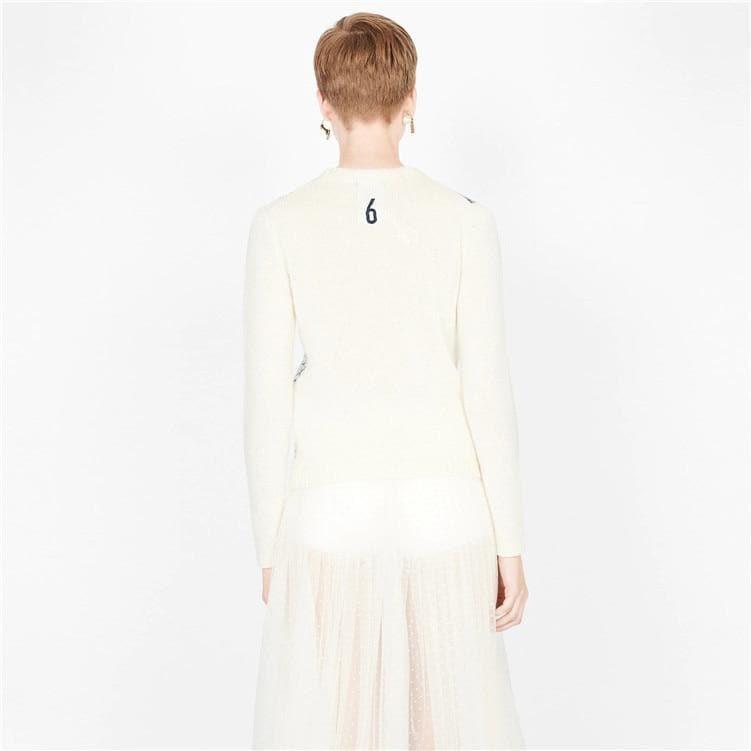 white embroidered sweater