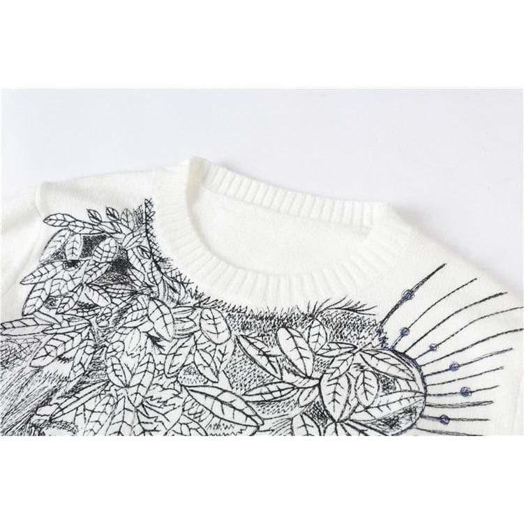 white embroidered sweater