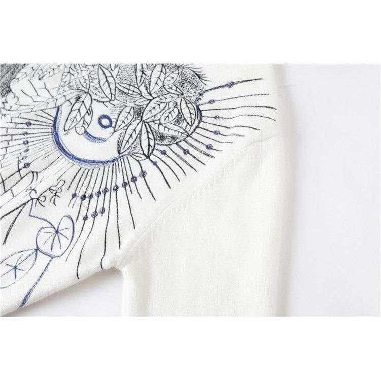 white embroidered sweater