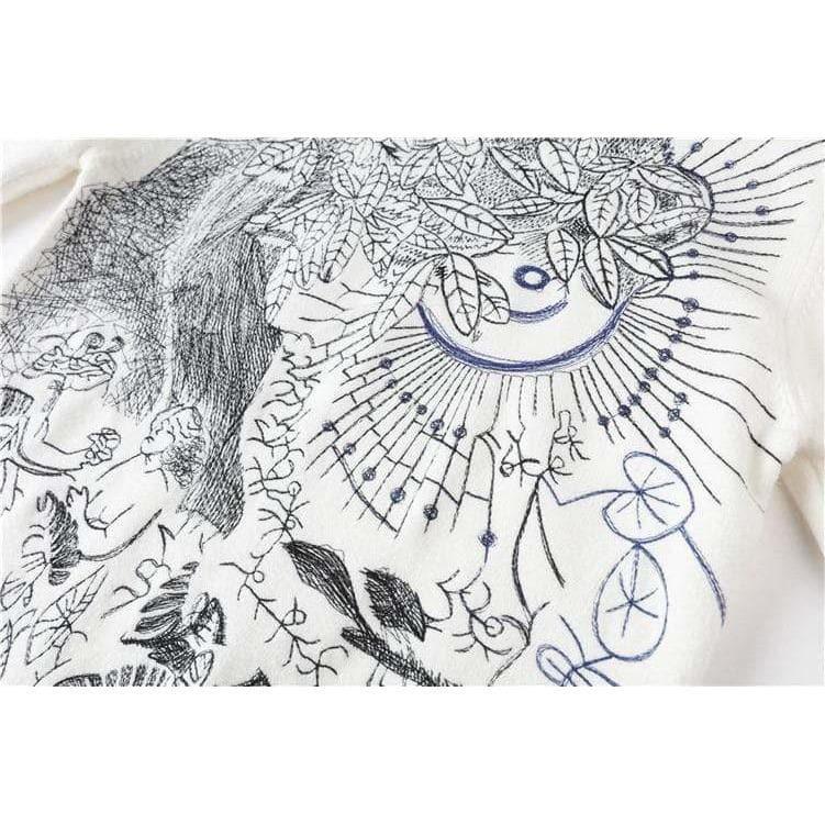 white embroidered sweater